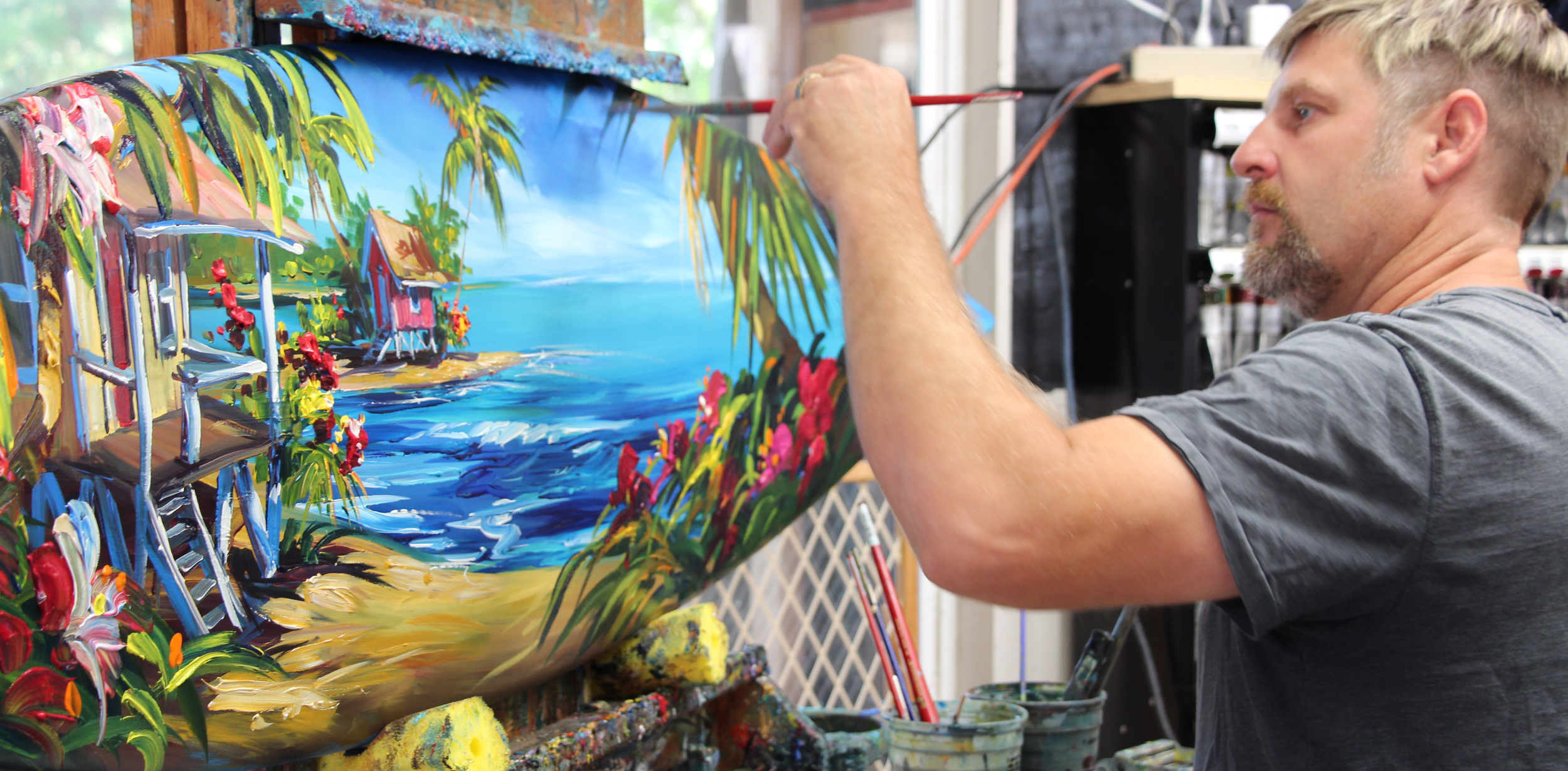 Oceanside local, Steve Barton, creates a gorgeous tropical oil painting on a surfboard.